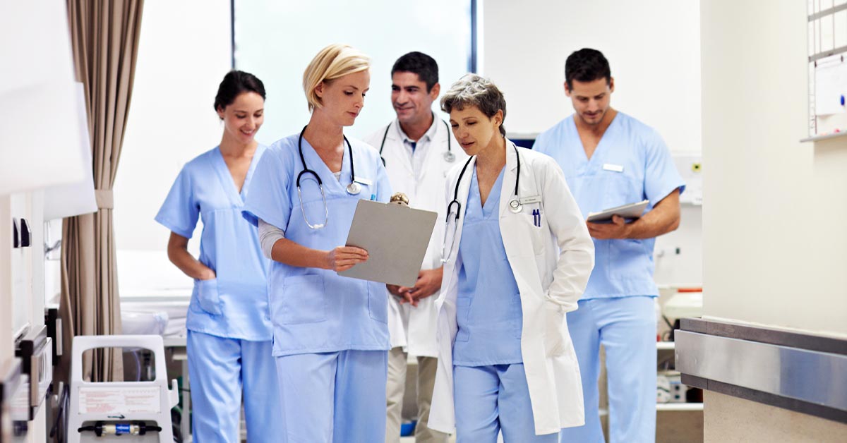 charge nurse with other nurses 1200x628 1